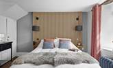 The second bedroom marries modern materials with farmhouse charm. - Thumbnail Image
