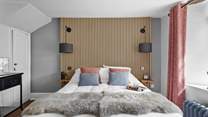 This bedroom marries modern materials with farmhouse charm.