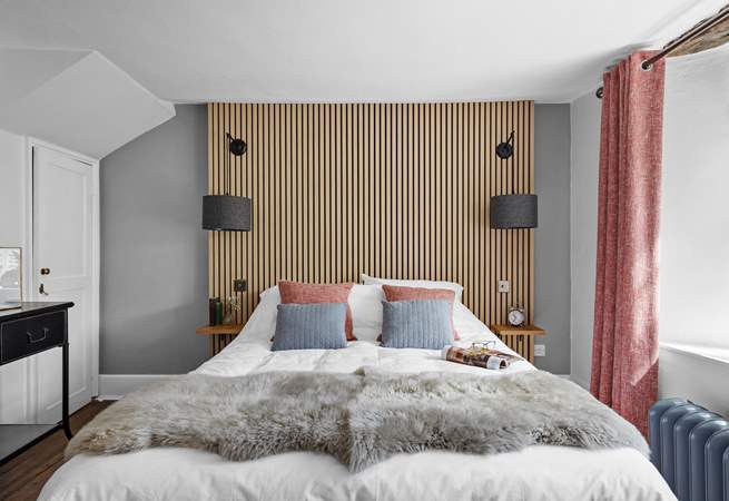 The second bedroom marries modern materials with farmhouse charm.