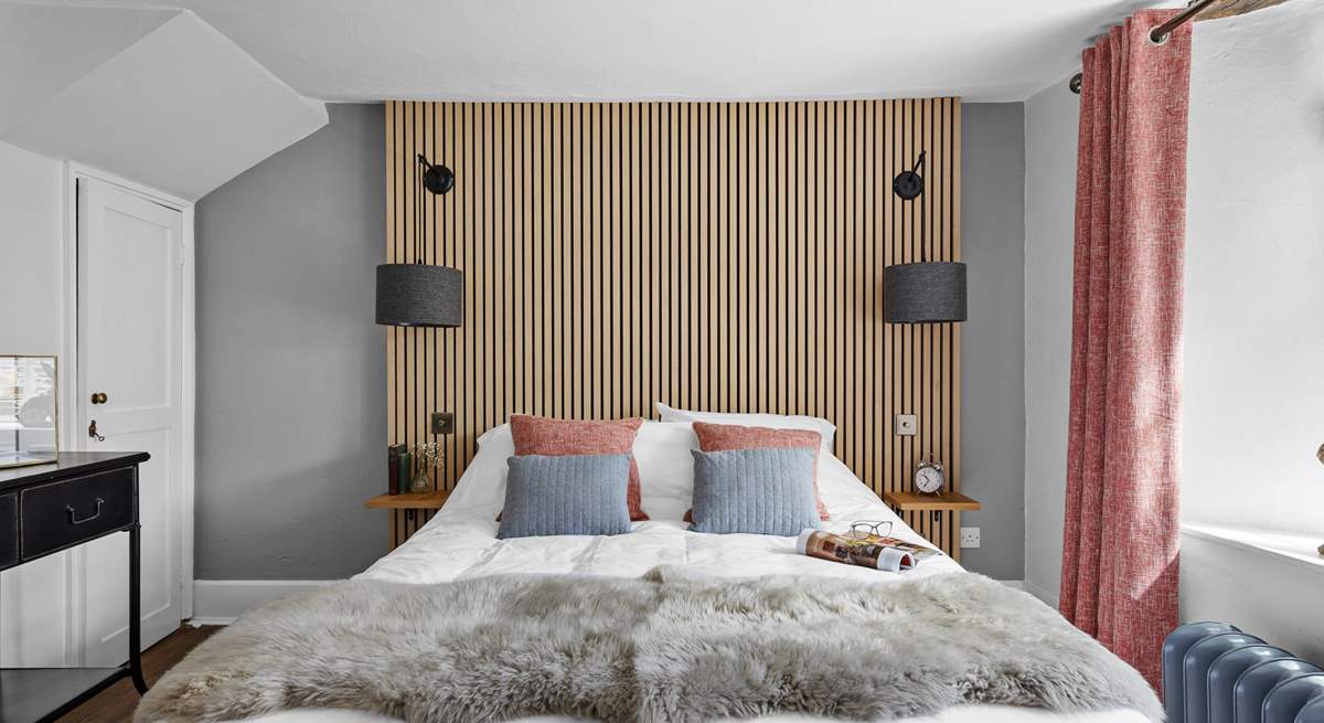 The second bedroom marries modern materials with farmhouse charm.