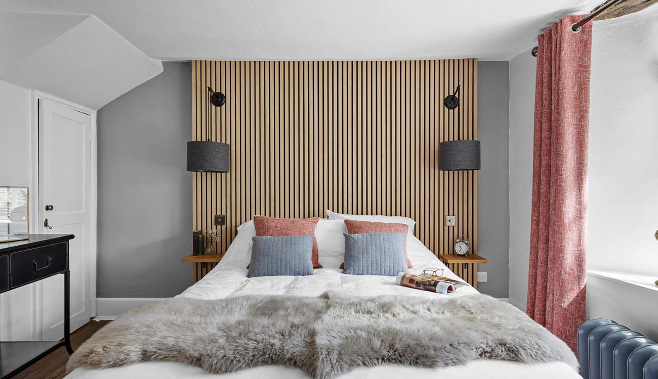 The second bedroom marries modern materials with farmhouse charm.