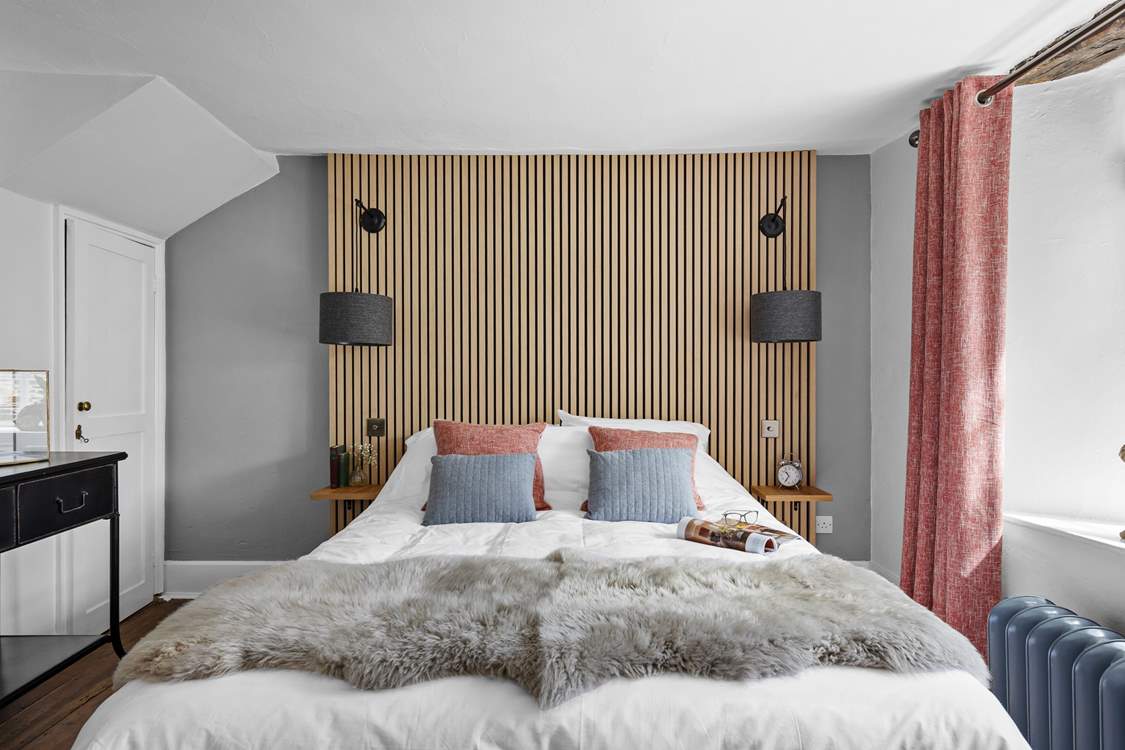 The second bedroom marries modern materials with farmhouse charm.