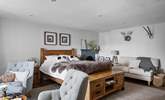 A bedroom of dreams with lots of seating options. - Thumbnail Image