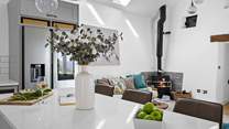 The wood-burner offers a touch of luxury.