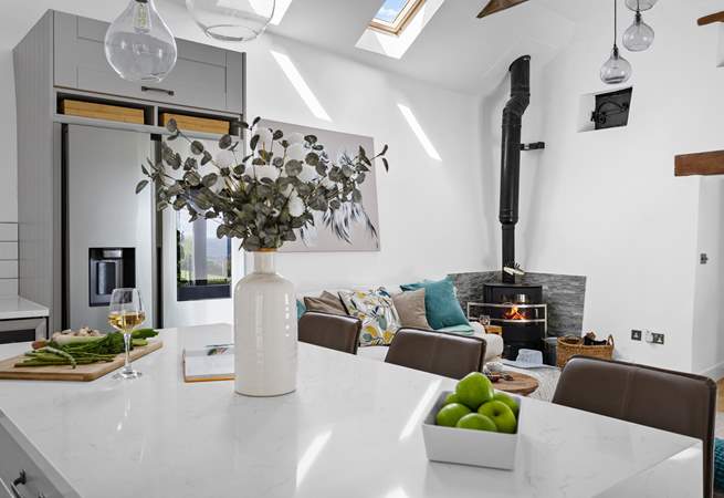 The wood-burner offers a touch of luxury.