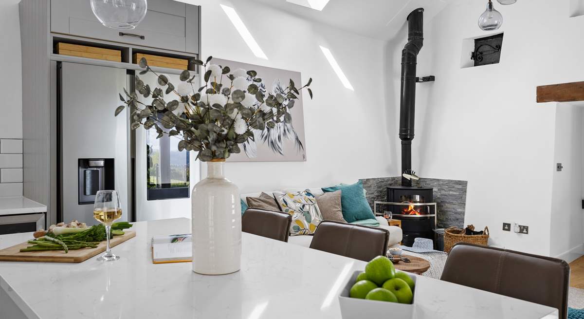 The wood-burner offers a touch of luxury.
