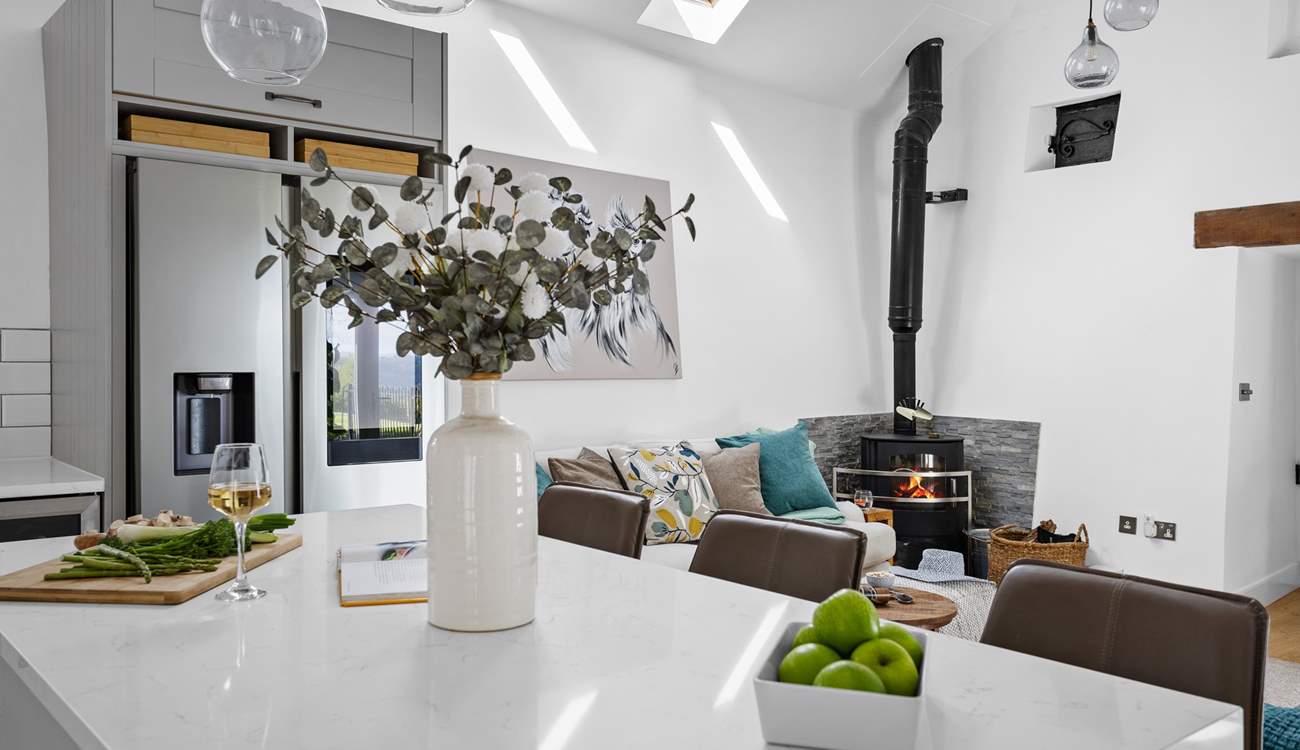 The wood-burner offers a touch of luxury.