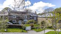 The main farmhouse sits behind The Aval Loft, to the right of the picture, in a gorgeous rural setting.