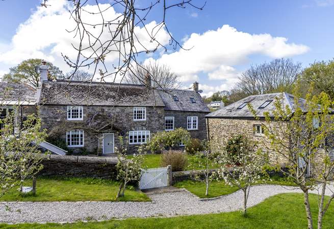The main farmhouse sits behind The Aval Loft, to the right of the picture, in a gorgeous rural setting.