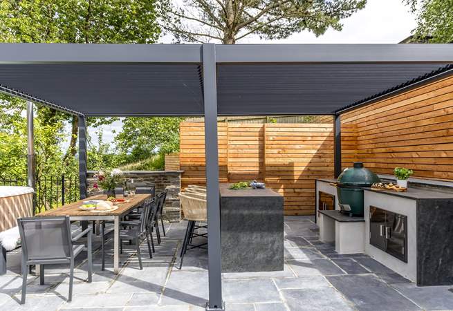 What could be better than cooking a feast in the outdoor kitchen and dining al fresco under the bespoke pergola.