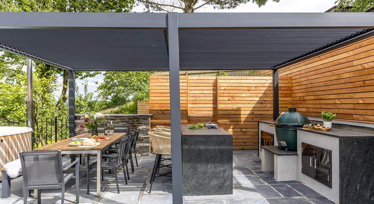 What could be better than cooking a feast in the outdoor kitchen and dining al fresco under the bespoke pergola.