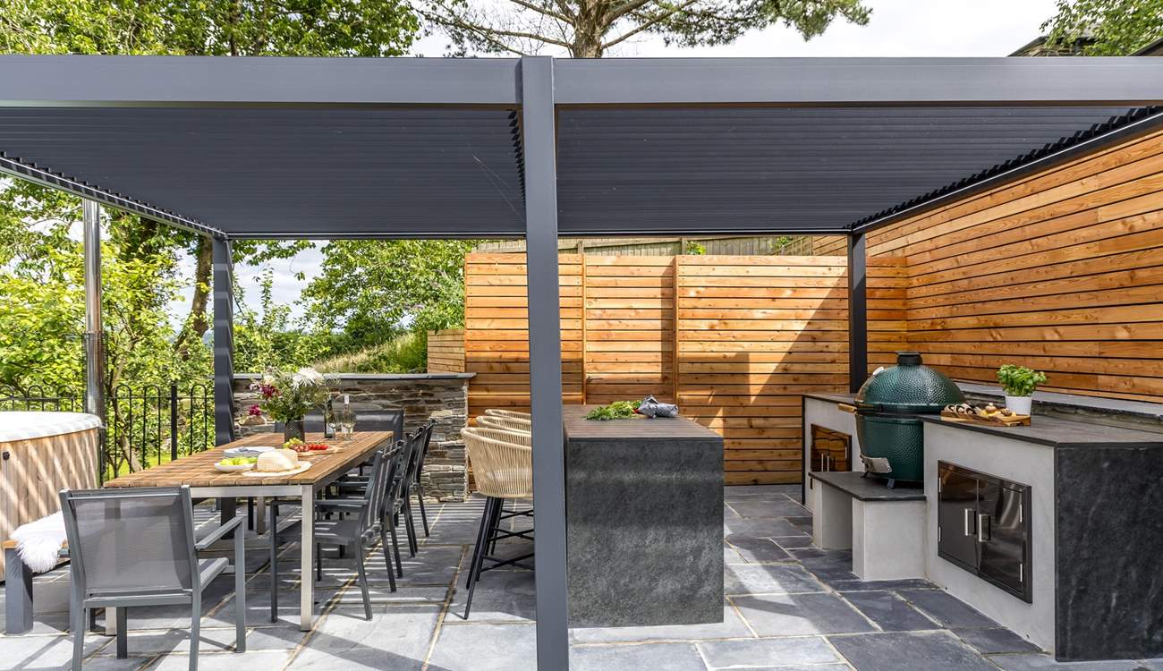 What could be better than cooking a feast in the outdoor kitchen and dining al fresco under the bespoke pergola.