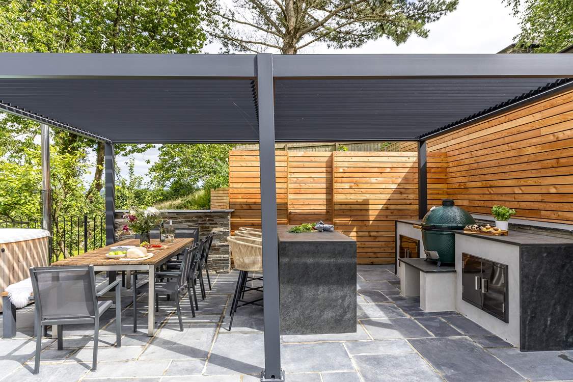 What could be better than cooking a feast in the outdoor kitchen and dining al fresco under the bespoke pergola.