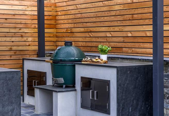 The granite worktops offer a luxurious finish to the outdoor kitchen.