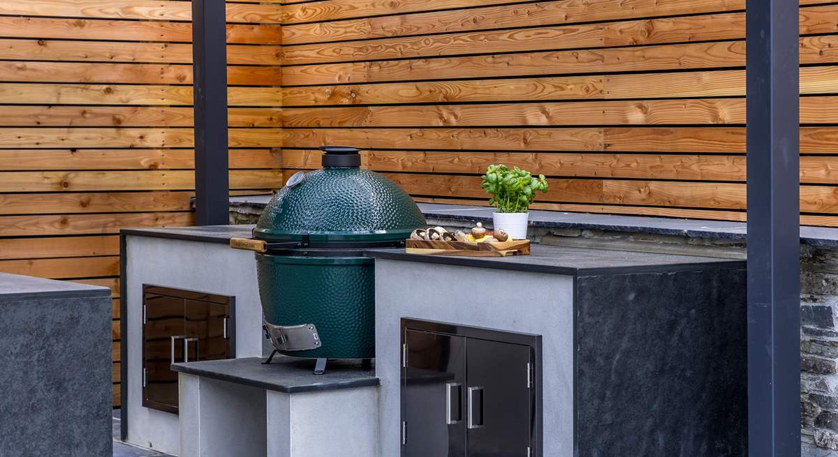 The granite worktops offer a luxurious finish to the outdoor kitchen.