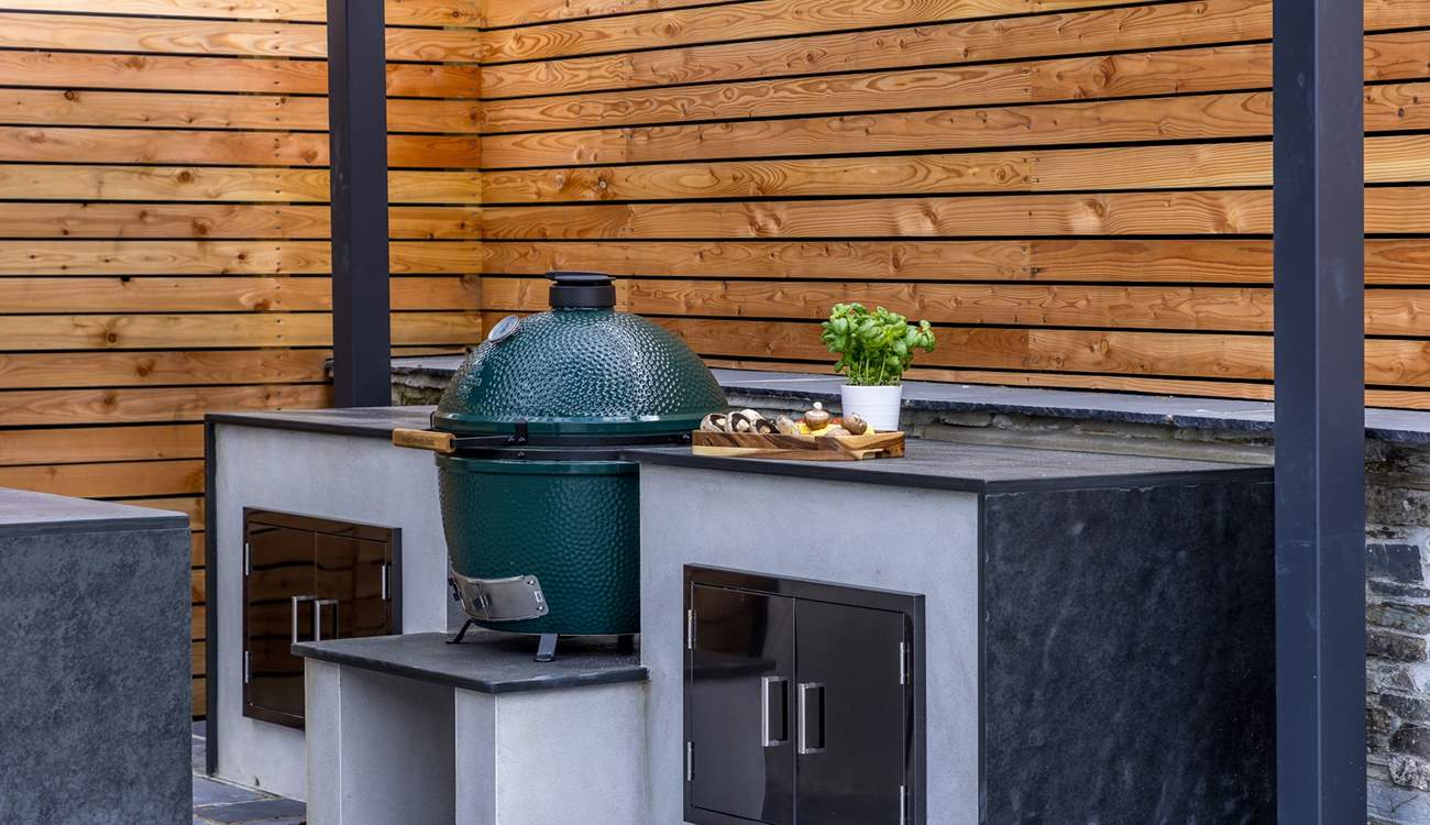 The granite worktops offer a luxurious finish to the outdoor kitchen.