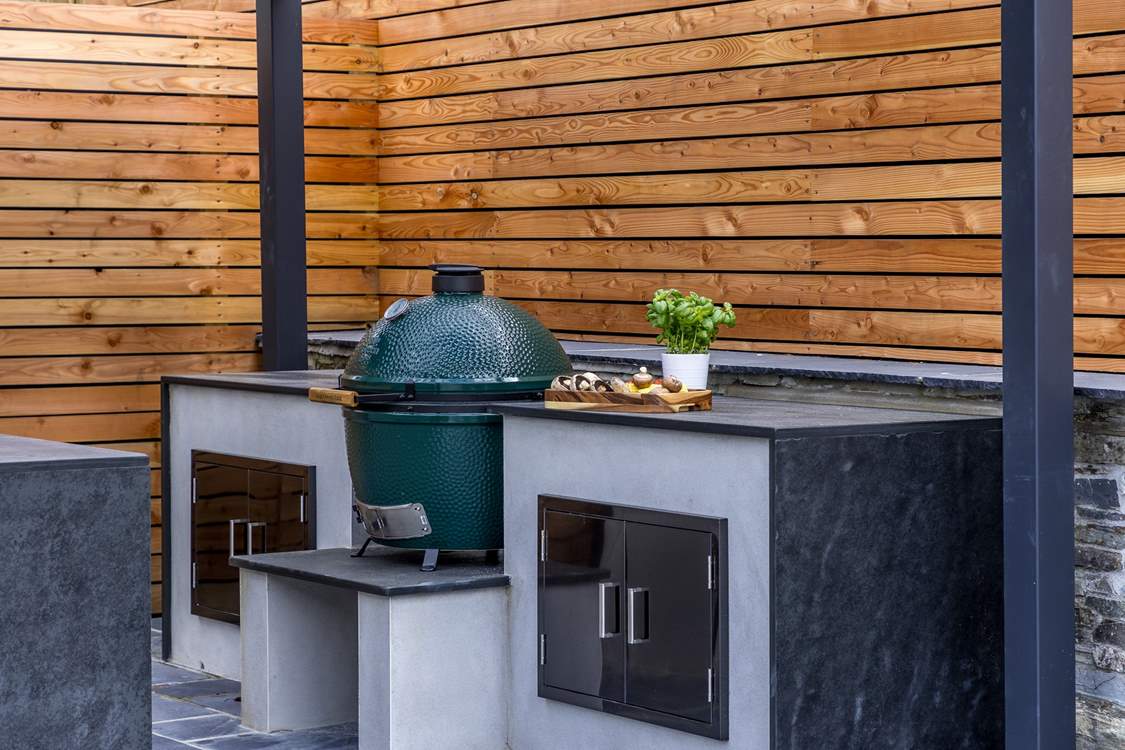 The granite worktops offer a luxurious finish to the outdoor kitchen.