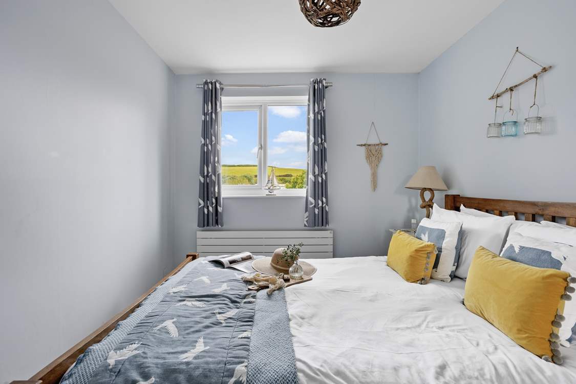 A cosy coastal bedroom awaits.