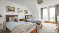 First floor twin room with Juliet balcony and views to the sea.