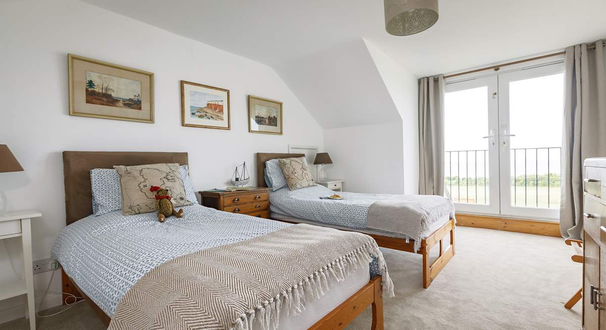 First floor twin room with Juliet balcony and views to the sea.