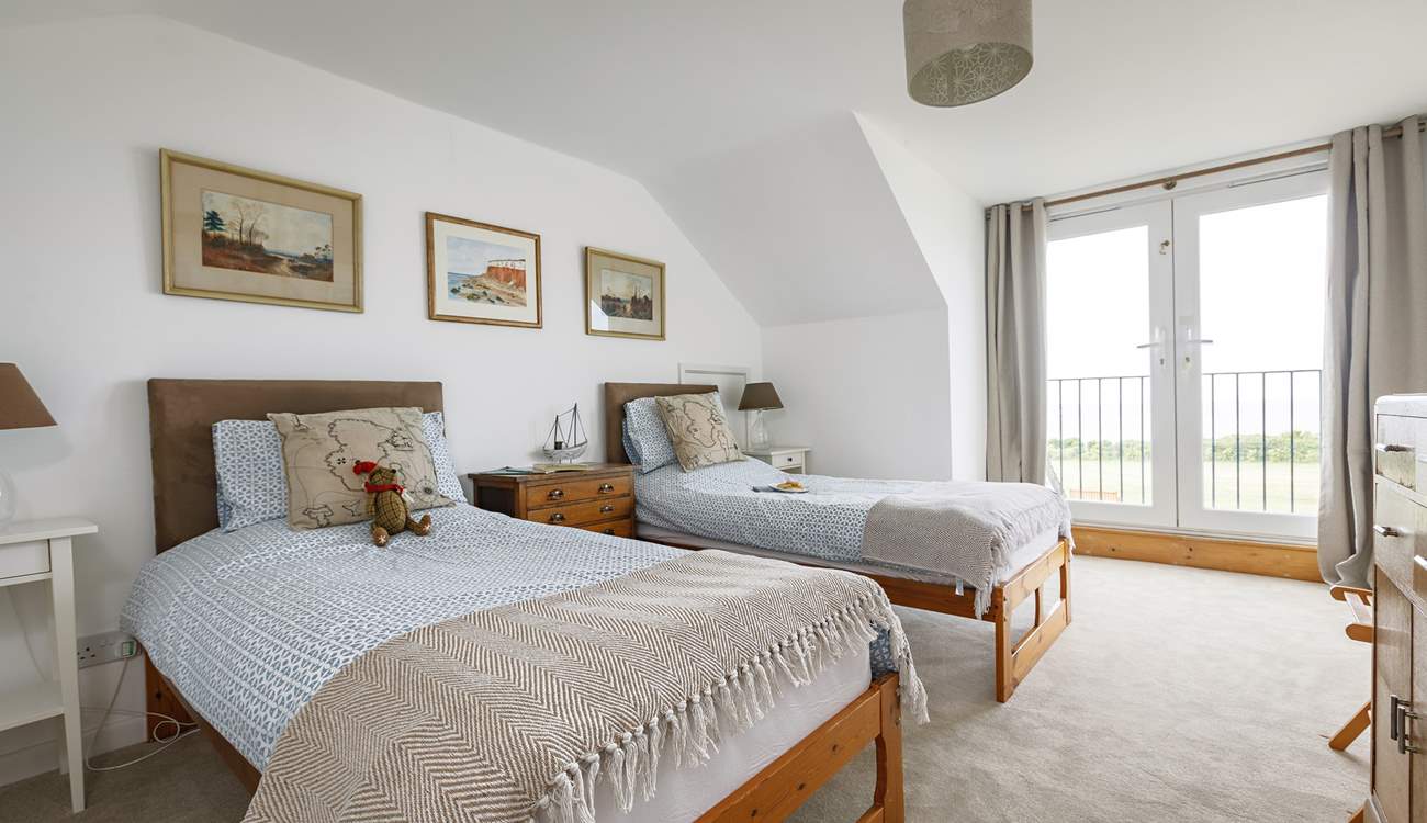 First floor twin room with Juliet balcony and views to the sea.