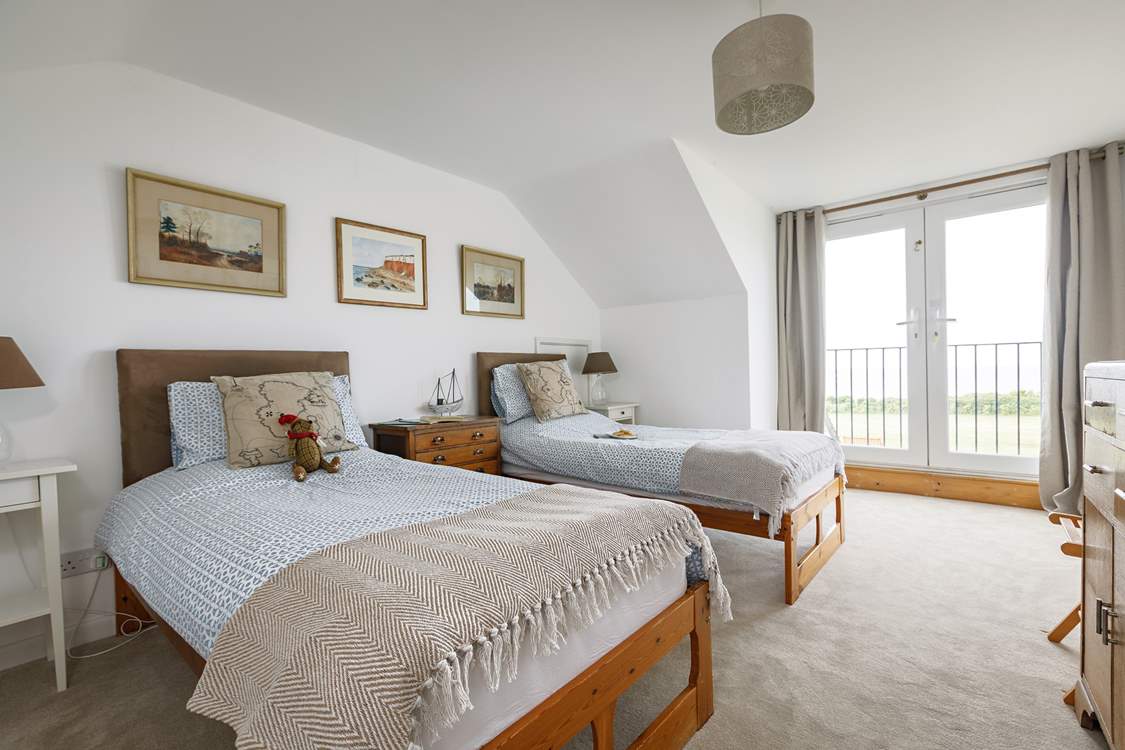 First floor twin room with Juliet balcony and views to the sea.