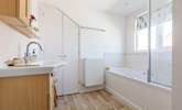 The upstairs bathroom is light and airy with privacy blind. - Thumbnail Image