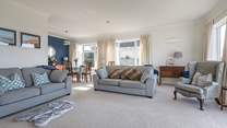 Chillout with friends and family in this large yet cosy sitting/dining-room.