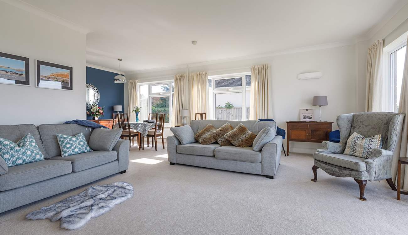 Chillout with friends and family in this large yet cosy sitting/dining-room.