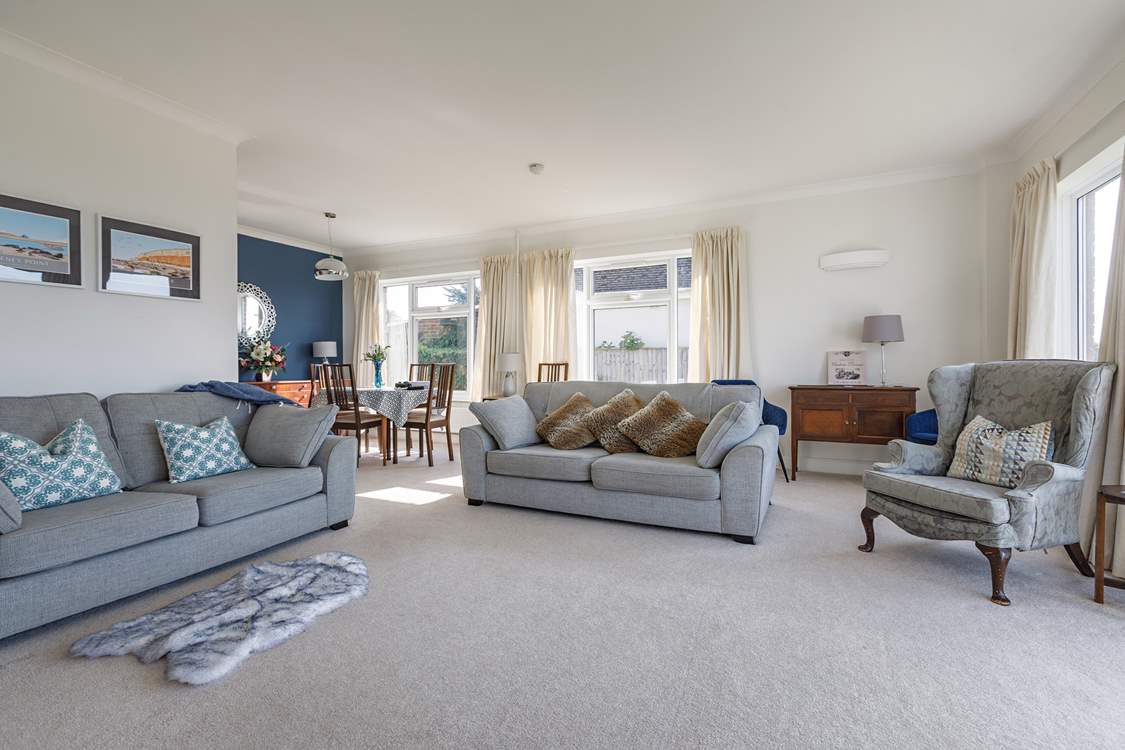 Chillout with friends and family in this large yet cosy sitting/dining-room.