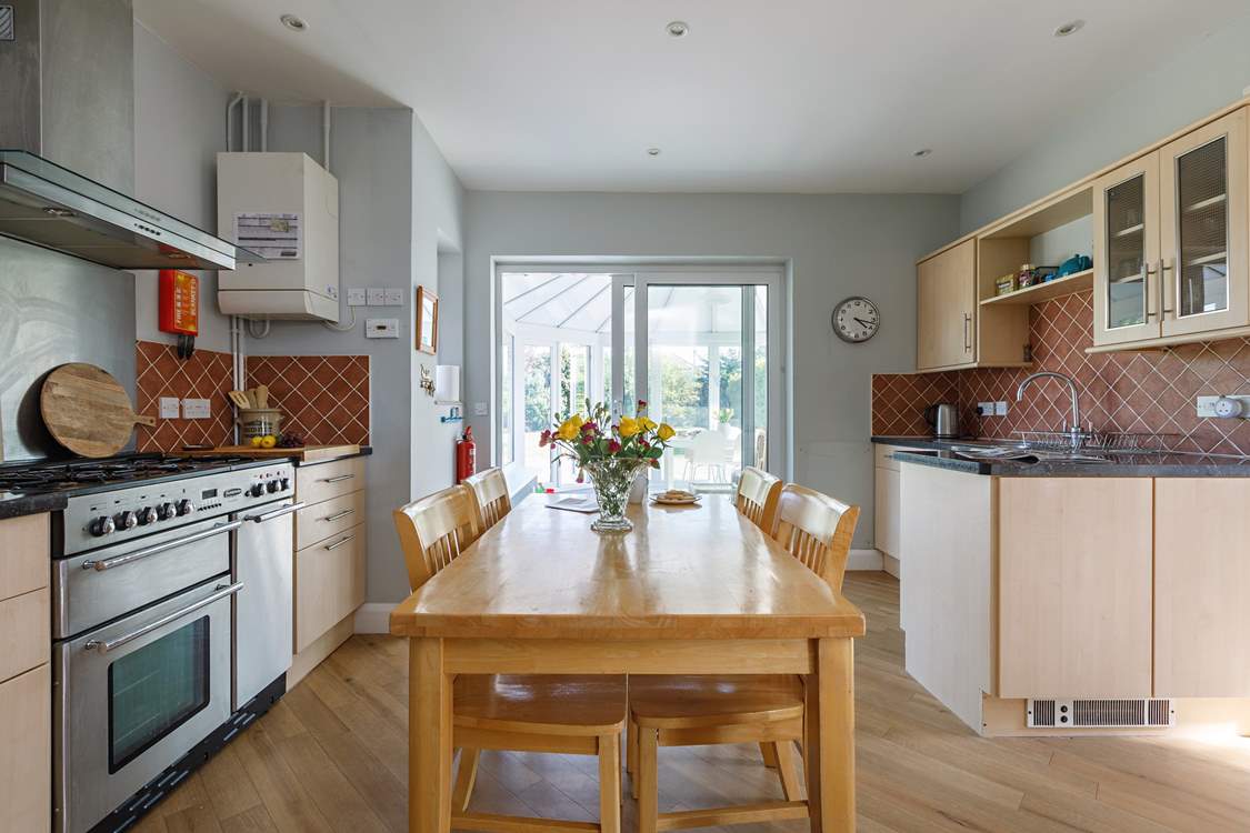 Look out into the conservatory from the light-filled kitchen.