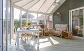 A beautiful place for year round relaxing in this light-filled space. - Thumbnail Image