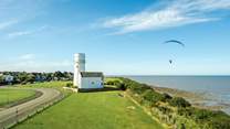 Peruse the colourful skies close by where paragliders take to the skies.