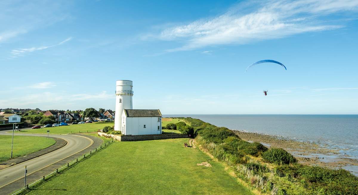 Peruse the colourful skies close by where paragliders take to the skies.