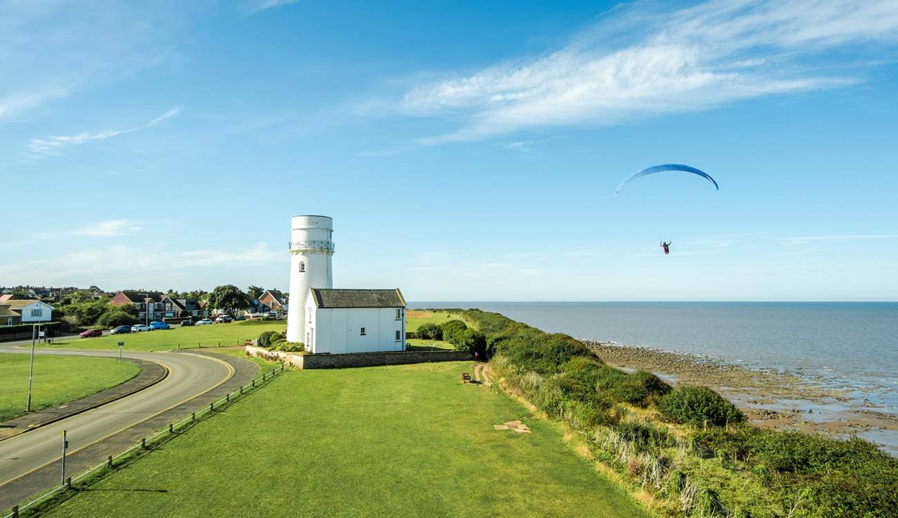 Peruse the colourful skies close by where paragliders take to the skies.