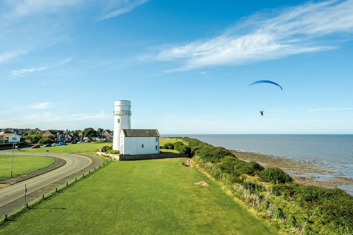 Peruse the colourful skies close by where paragliders take to the skies.