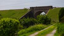 The lane in front of the cottage with the viaduct in view. 