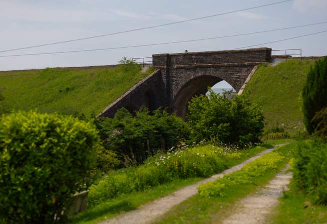 The lane in front of the cottage with the viaduct in view. 