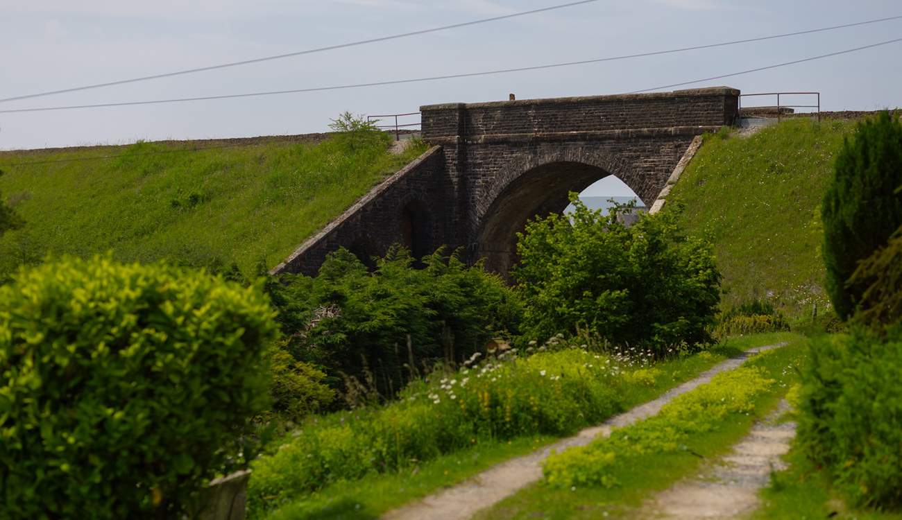 The lane in front of the cottage with the viaduct in view. 