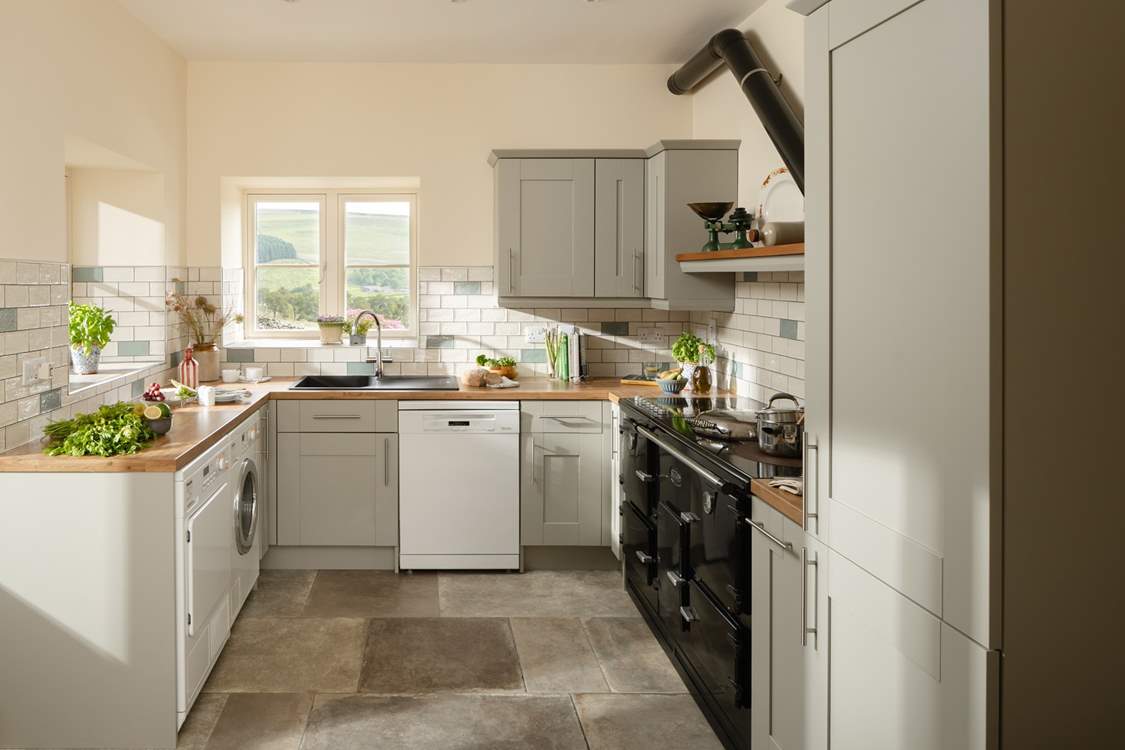 There is everything you need in the kitchen to whip up a memorable meal. Please note the range cooker is not in use.