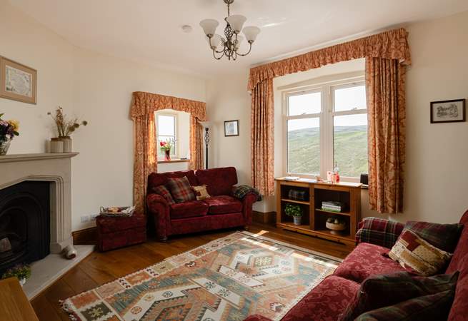The sitting-room is just the place to watch the changing light over the hills. 