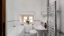 The bathroom has a bath with shower over, just the place for a long soak after hiking over the Dales. 