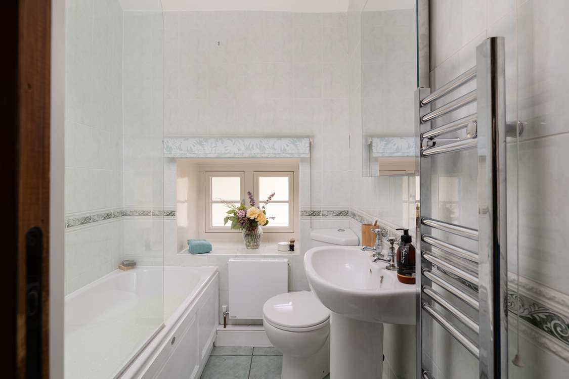 The bathroom has a bath with shower over, just the place for a long soak after hiking over the Dales.