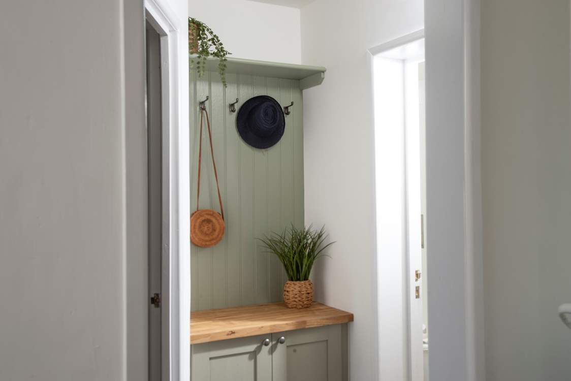 A useful area to store coats, hats, walking boots and flip flops.