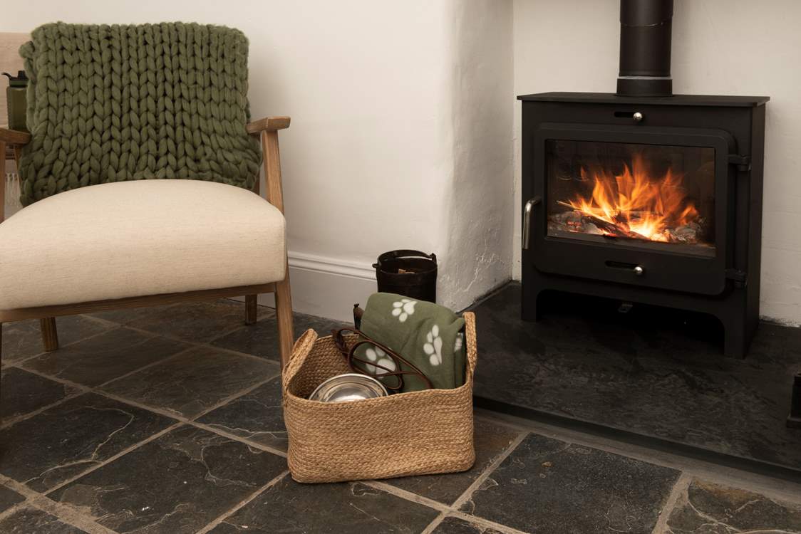 The toasty wood-burner makes the sitting-room warm and cosy.
