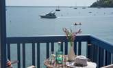Watch the comings and goings along the water. - Thumbnail Image