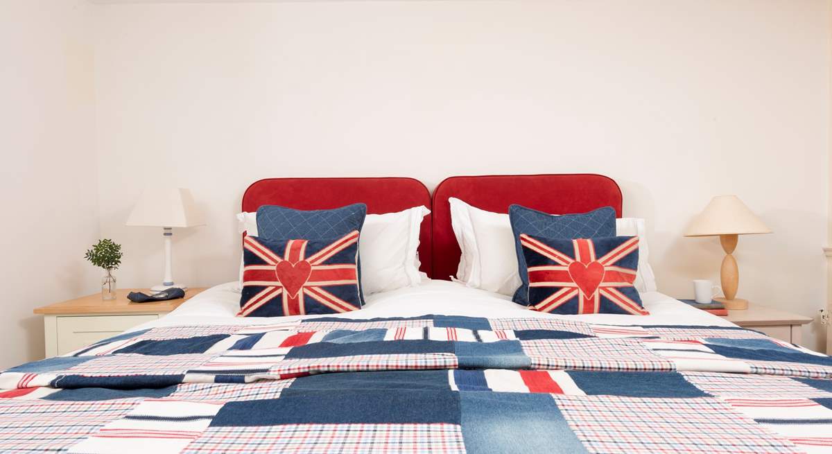 Bedroom 1 is wonderfully patriotic with its red, white and blue decor. 