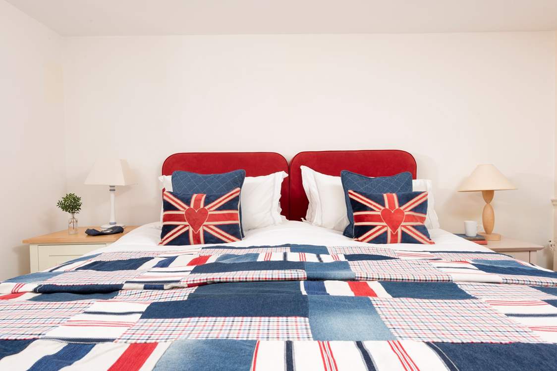 Bedroom 1 is wonderfully patriotic with its red, white and blue decor.