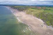 When the tide is out, the beach along Whitsand Bay stretches for miles and miles.
