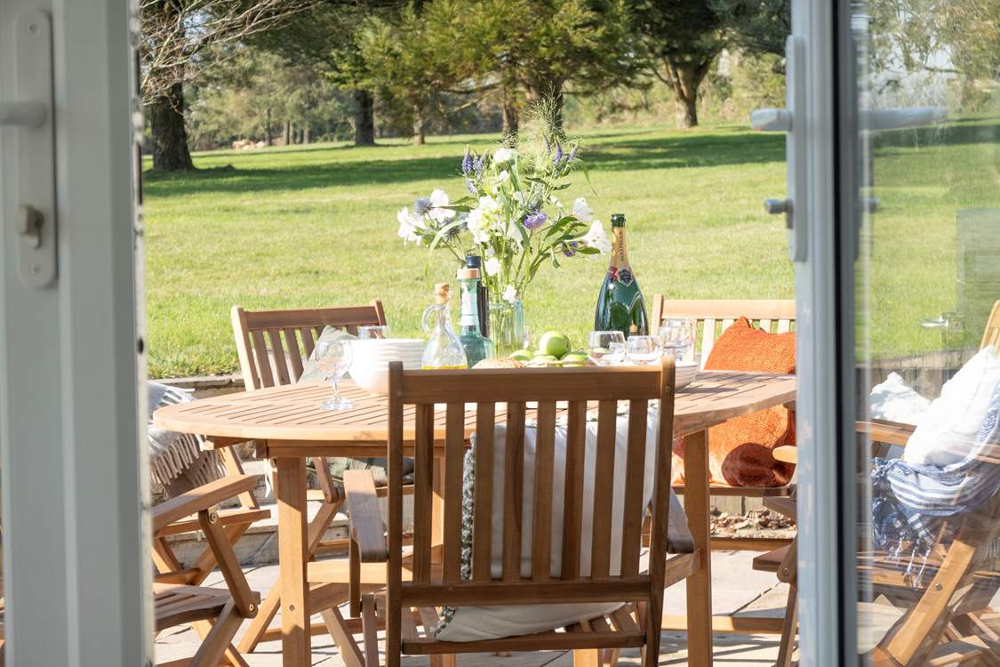 Head out from the sitting-room and the kitchen to the sunny terrace.